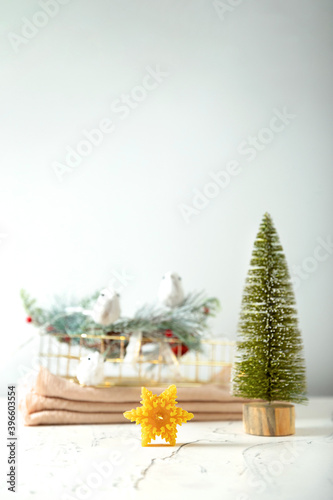 wax candles in the New Year's interior, on a light background, home comfort