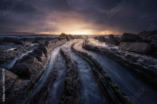 Sunset in the Cantabrian Sea, in the Barrika Beach with their famous rock formations, the flysch