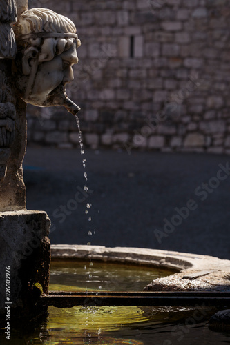 Water fountain dating from 1852 dedicated to Jean-Louis Cavalier, in the charming village of Gourdon, a medieval fortress overlooking the Loup Valley in the Alpes-Maritimes department, in France