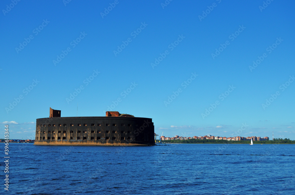 Fort Marine Military historic black from a fire in the Gulf of Finland near Kronstadt. Russia, St. Petersburg, 17.08.2020. High quality photo