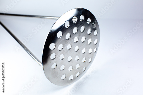 Bilde på lerret Close up Kitchen metal potato masher for making mashed potatoes on white background