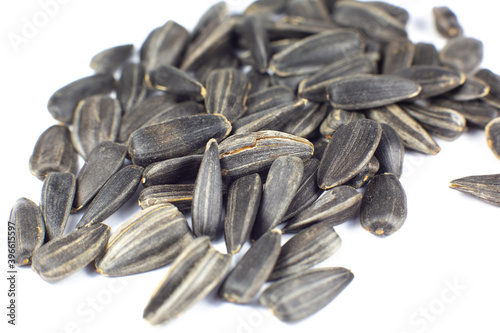 Fried black sunflowers seeds, close up.