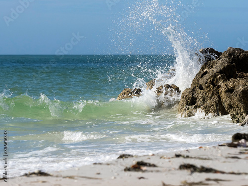 Waves crashing on rocks on the Gulf of Mexico at St. Pete Beach, Florida.