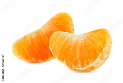 Two slices of tangerine isolated on a white background.
