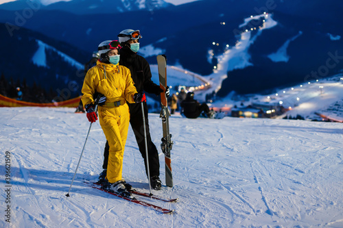 Skier in ski resort. Man and woman together in winter nature. Romantic scenery. Sport photo © Angelov