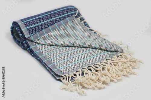 Peshtemal Turkish bath cotton towel folded textile. Beautiful bright colors with natural light background. Perfect online market digital shop sales. photo