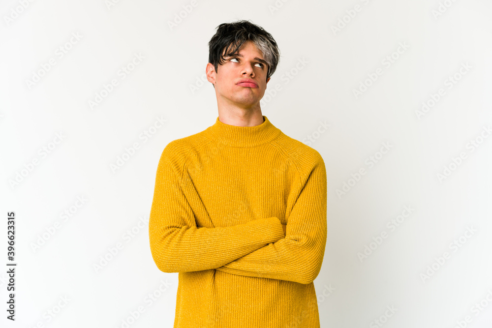 Young skinny hispanic man tired of a repetitive task. Young skinny hispanic man tired of a repetitive task.