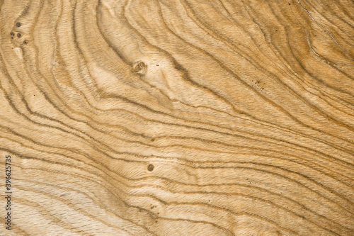 Natural wooden background with beautiful streaks. A whole piece of wood