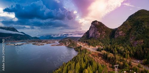 Aerial panoramic view of Sea to Sky Highway with Chief Mountain in the background. Colorful Sunrise Sky Art Render. Taken near Squamish, North of Vancouver, British Columbia, Canada.