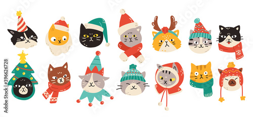Set of Christmas cats wearing winter accessories like hats and scarves. Vector illustration of cute animal faces in festive outfits displaying various emotions in colorful cartoon style.