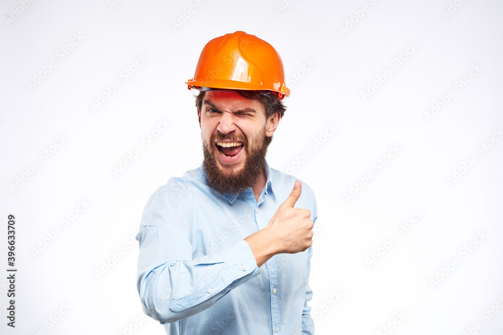 Engineers shirt orange hard hat construction lifestyle emotions cropped view light background