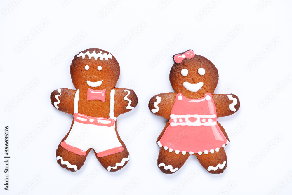 The hand-made eatable gingerbread little men on white background The hand-made eatable gingerbread little men on white background