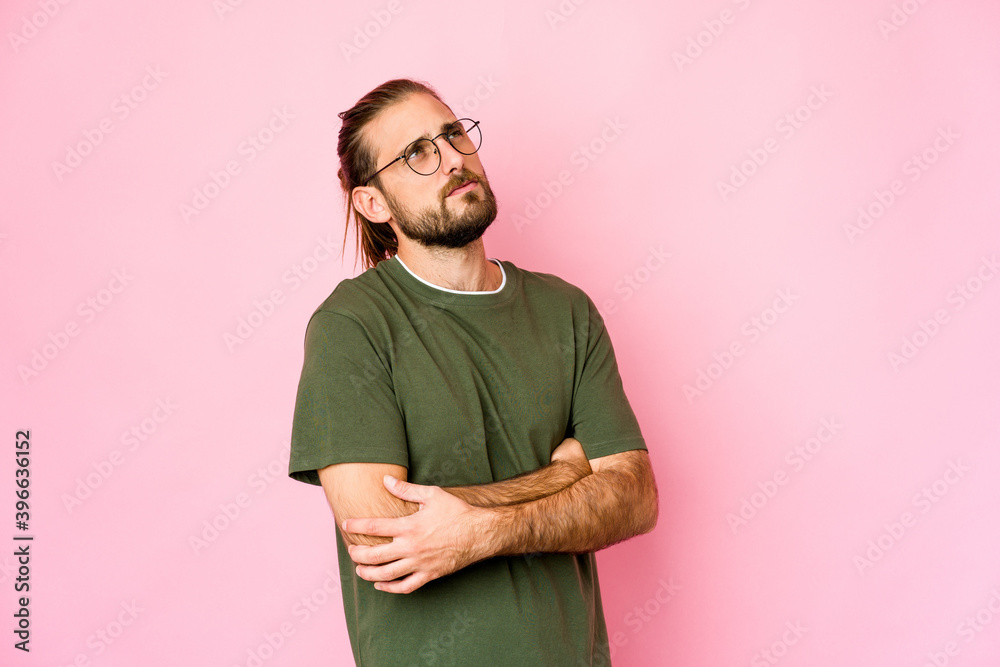 Young man with long hair look dreaming of achieving goals and purposes Young man with long hair look dreaming of achieving goals and purposes