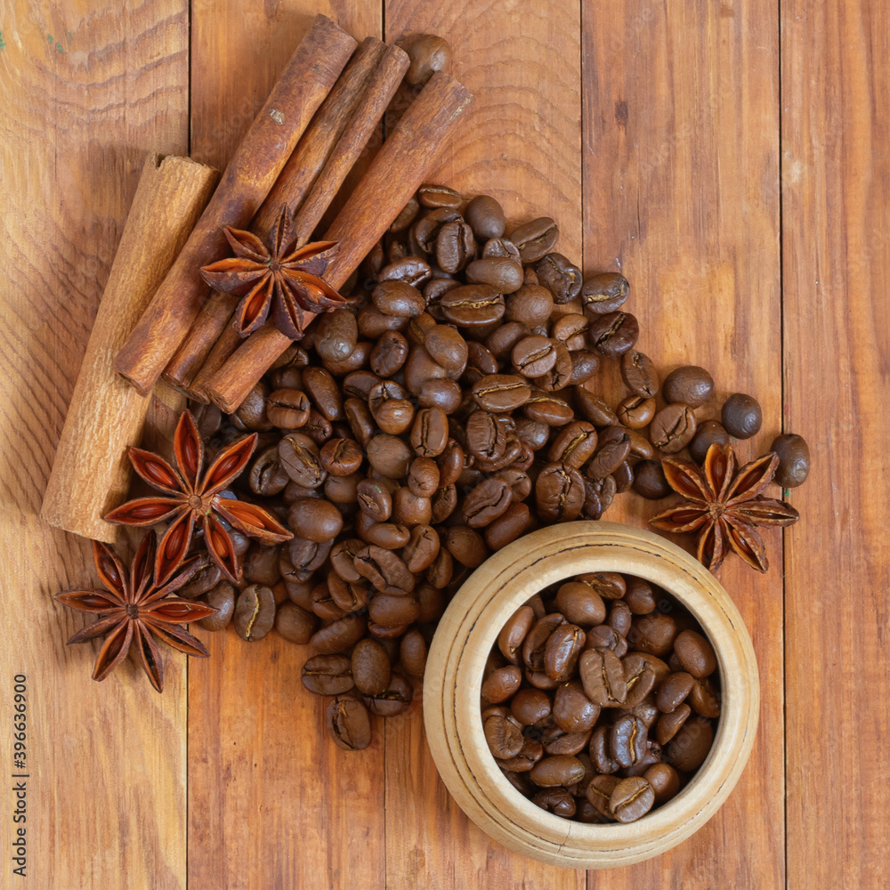 Fototapeta image of coffee beans and cups with coffee on wooden table top view