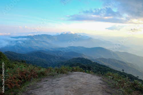 In selective focus a beautiful panorama view of Doi Inthanon peak with mountains line and blue sky 