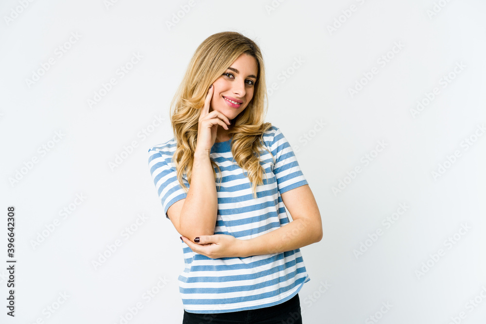 Young caucasian blonde woman smiling happy and confident, touching chin with hand. Young caucasian blonde woman smiling happy and confident, touching chin with hand.