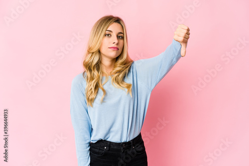 Young caucasian blonde woman doing a denial gesture