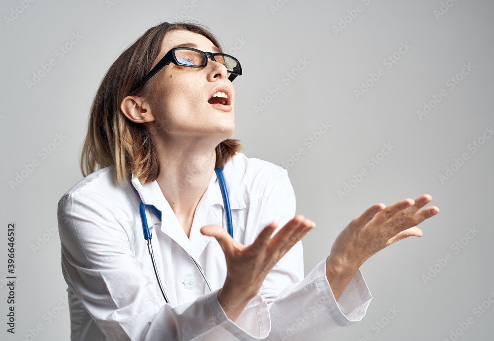 portrait of female nurse in medical gown and blue stethoscope portrait of female nurse in medical gown and blue stethoscope