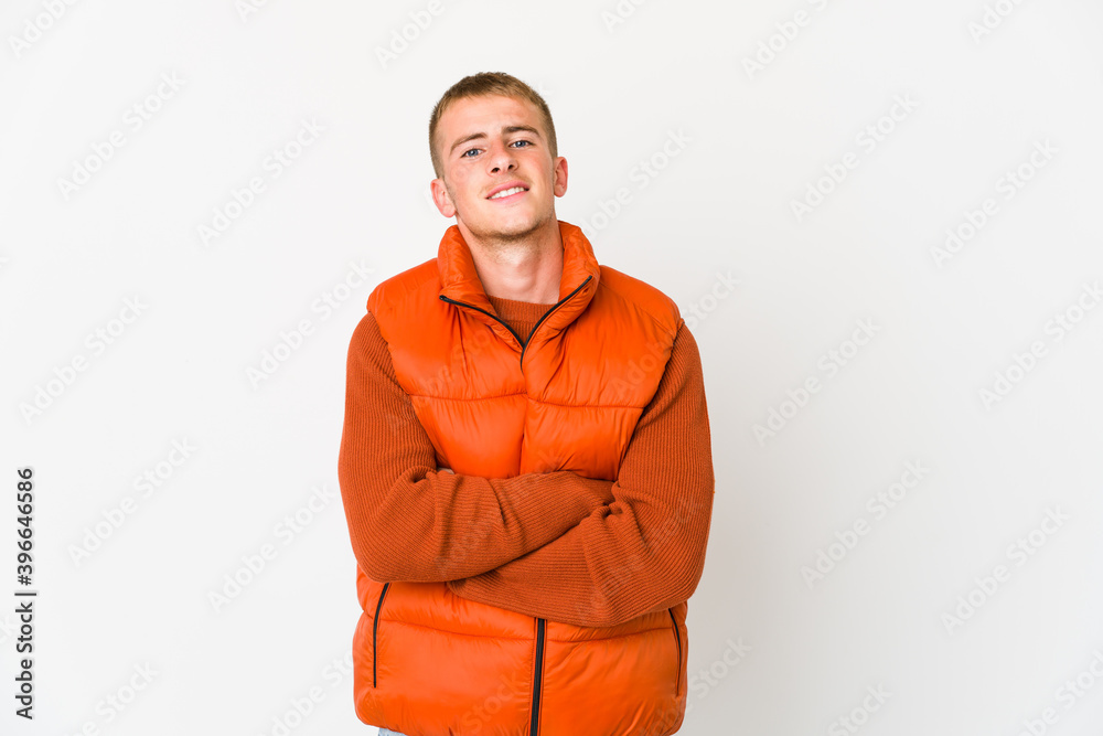 Young caucasian handsome man who feels confident, crossing arms with determination. Young caucasian handsome man who feels confident, crossing arms with determination.