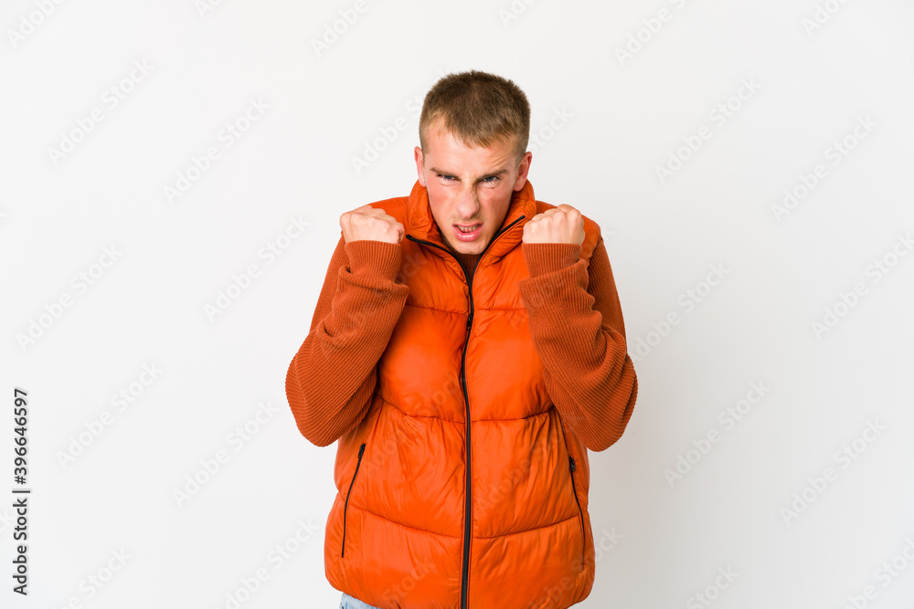 Young caucasian handsome man showing fist to camera, aggressive facial expression. Young caucasian handsome man showing fist to camera, aggressive facial expression.