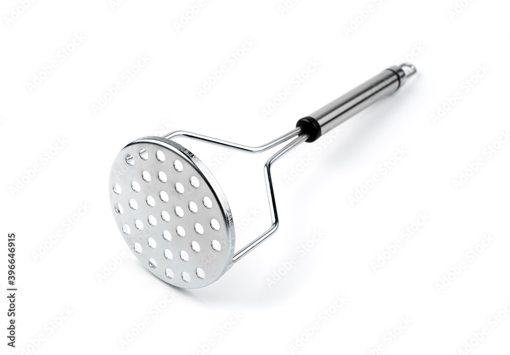 Metal cooking item for making mashed potatoes on a white background. Side view. The concept of cooking. Metal cooking item for making mashed potatoes on a white background. Side view. The concept of cooking.