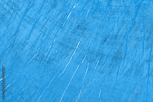 Abstract blue background with cracks. Grunge background.