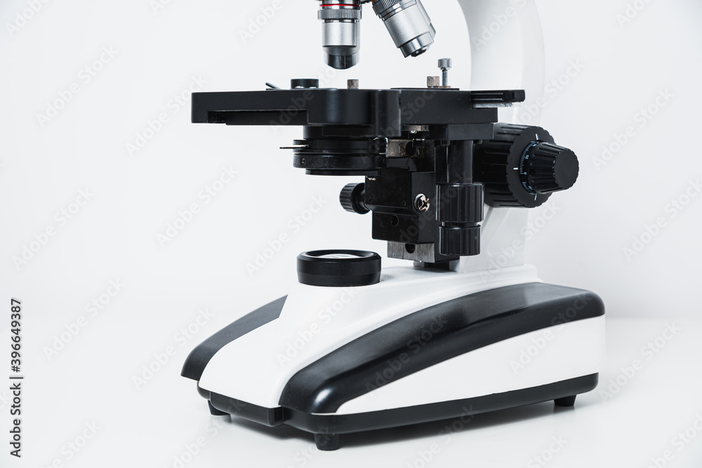 Biological microscope on a gray stone background. Scientific concept, biology. Conducting biological research, checking tissues. Biological microscope on a gray stone background. Scientific concept, biology. Conducting biological research, checking tissues.