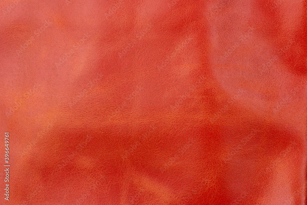 Orange red textured smooth leather surface background, small grain Orange red textured smooth leather surface background, small grain
