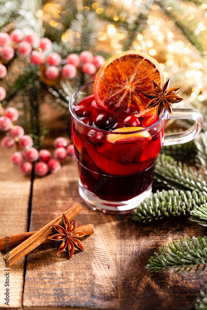 Christmas mulled wine with spices on a wooden rustic table. Christmas mulled wine with spices on a wooden rustic table.
