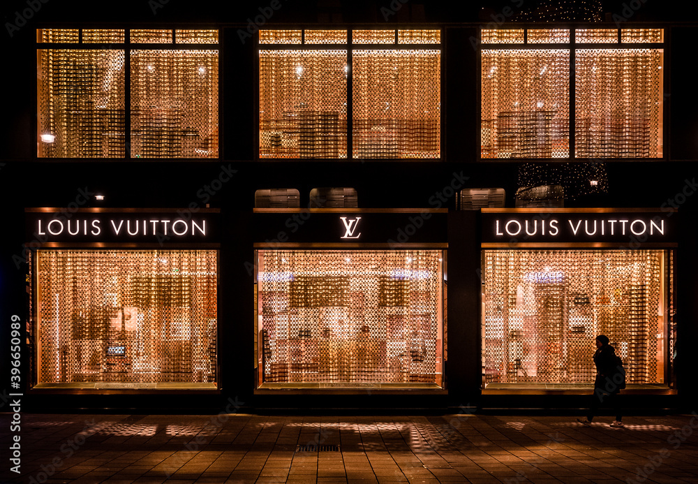 Derive Armstrong Brink Vienna, Austria: Louis Vuitton shop facade in the city center illuminated  in the night Stock Photo | Adobe Stock