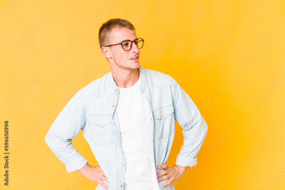 Young caucasian handsome man confident keeping hands on hips. Young caucasian handsome man confident keeping hands on hips.