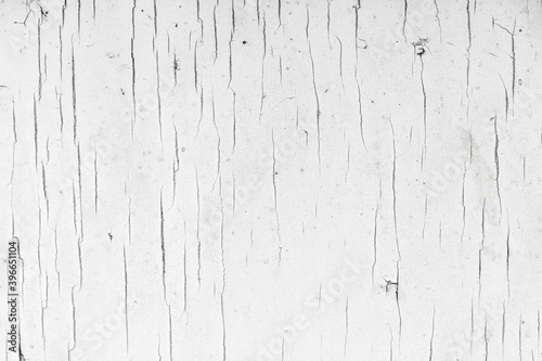 Old wooden surface with grungy white peeling paint