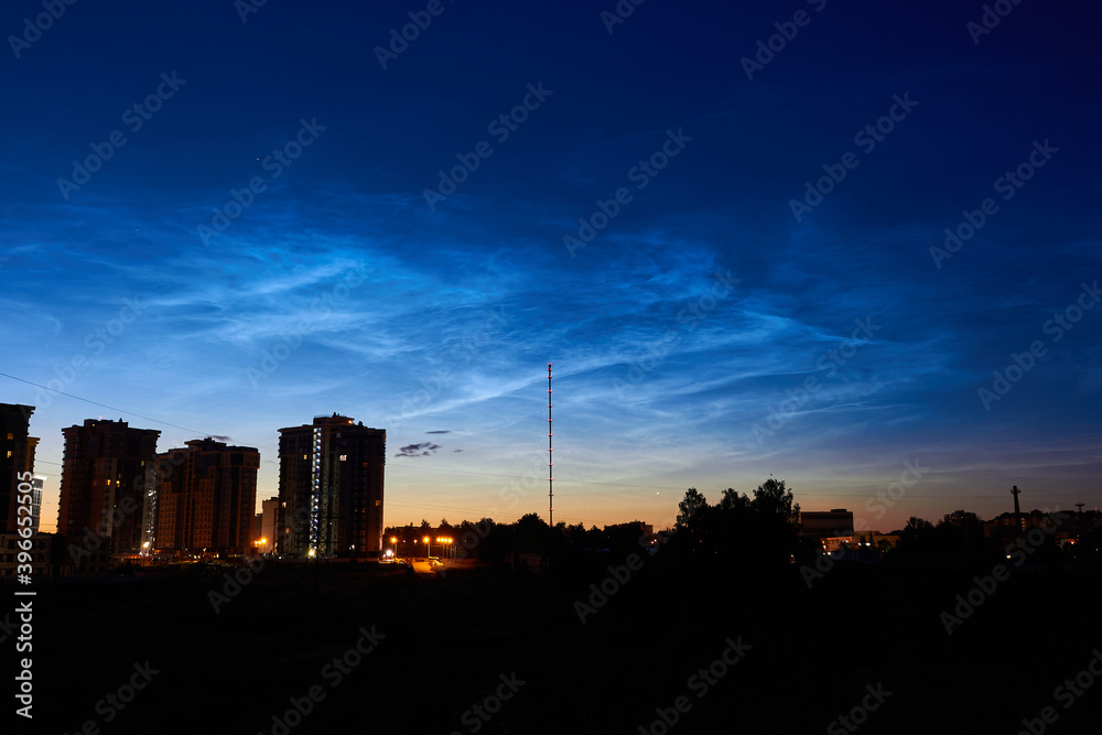 Noctilucent clouds (night shining clouds) in the night sky over the city. July 2020 - Obninsk, Russia Noctilucent clouds (night shining clouds) in the night sky over the city. July 2020 - Obninsk, Russia