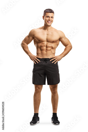 Full length portrait of a fit muscular man with naked torso