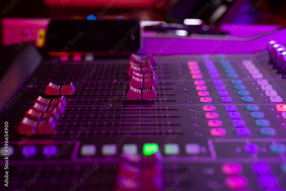 Audio mixer console, dj stand close up photo during party event, presentation, celebration, audio controls