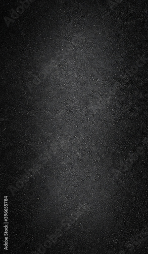 Dark vertical asphalt texture. Road abstract background.