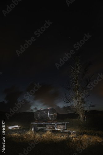 Silver bullet water tank at night
