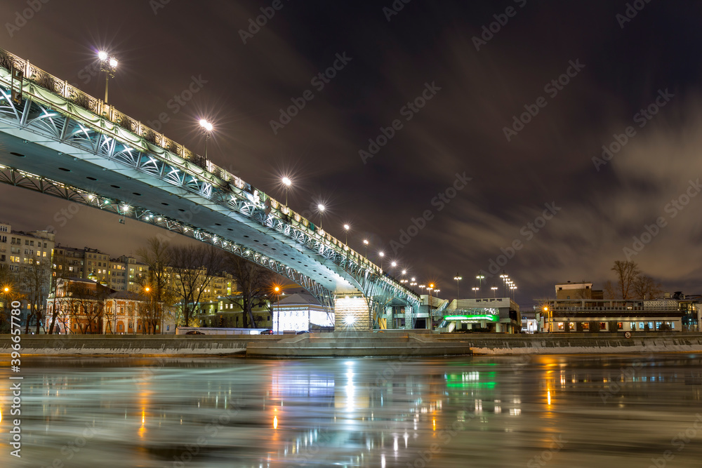 Winter view on Moscow river, citiscape with New Year illumination.