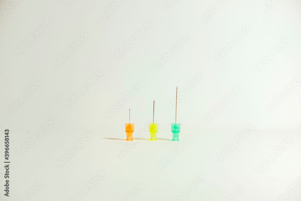 Three different size syringes on white background. Medical concept. Copy space. Three different size syringes on white background. Medical concept. Copy space.