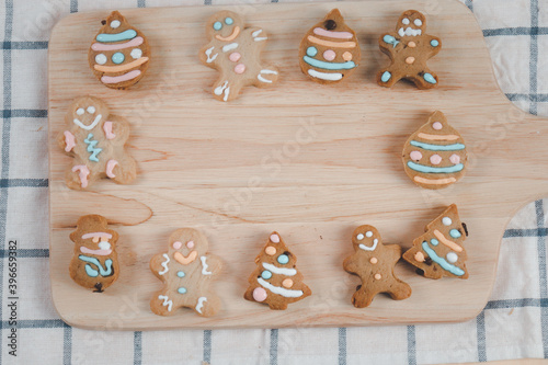 Homemade Christmas ginger bread cookies, Xmas gingerbread cookie on tray, preparing bakery, process of baking and cooking at home