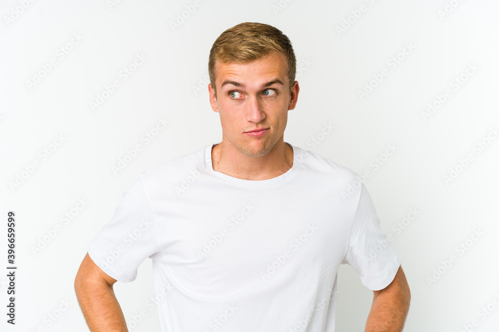 Young caucasian handsome man confused, feels doubtful and unsure. Young caucasian handsome man confused, feels doubtful and unsure.