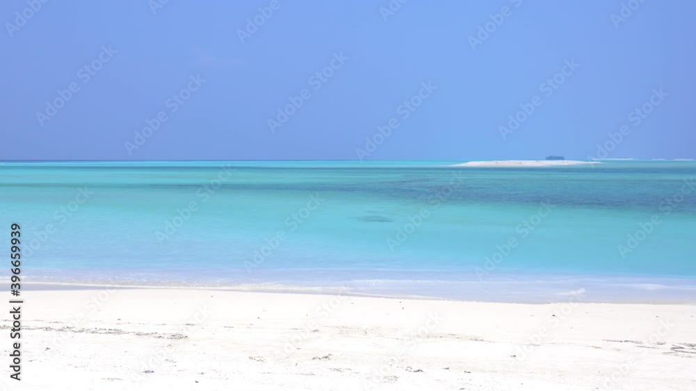 Santa Claus walking along beach and wag hands. Christmas vacation on islands