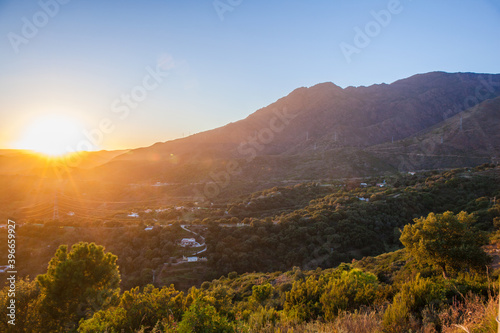 Sunset in mountains. Beautiful colorful sunset view. © Ekaterina