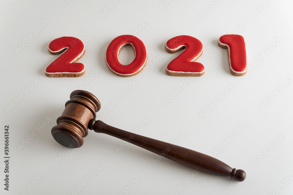 Red lettering 2021 and judges gavel or hammer for auction on white background. Red lettering 2021 and judges gavel or hammer for auction on white background.