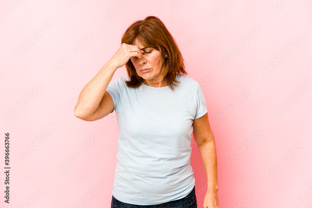 Senior caucasian woman isolated having a head ache, touching front of the face. Senior caucasian woman isolated having a head ache, touching front of the face.