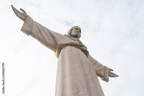 a large statue of Jesus Christ embracing the whole world photo