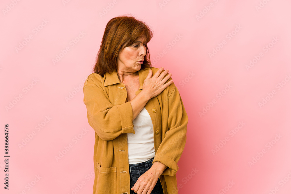 Senior caucasian woman isolated having a shoulder pain. Senior caucasian woman isolated having a shoulder pain.
