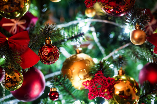 Colorful Christmas balls and bows on the christmas tree