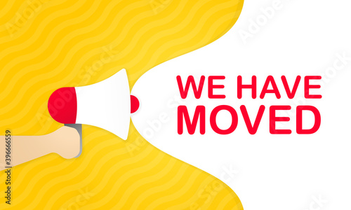 Hand holding megaphone with we have moved message in bubble speech banner. Loudspeaker. Announcement. Advertising. Vector EPS 10. Isolated on white background