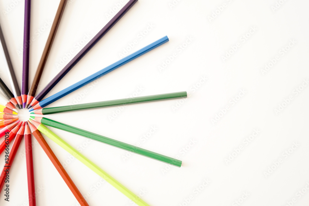 Multicolored pencils on white background Multicolored pencils on white background